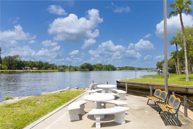 a view of a lake with couches and city view