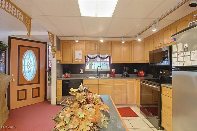 a kitchen with stainless steel appliances granite countertop lots of counter top space