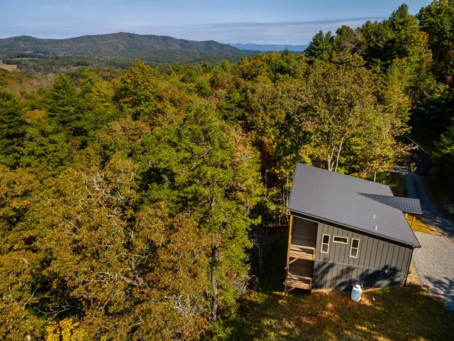 a view of a porch with wooden floor and stairs