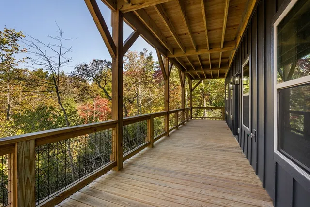 a bedroom with a bed and large window