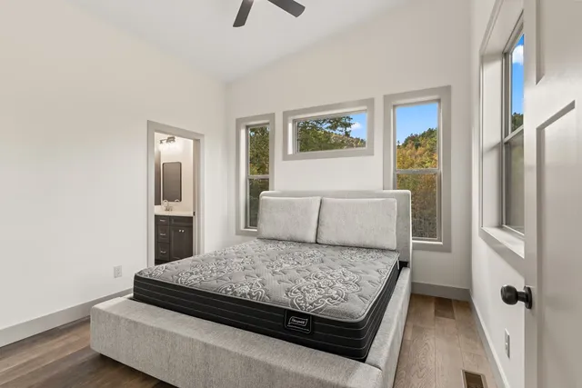 a living room with couch and a large window