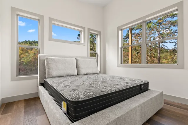 a bedroom with a bed and window