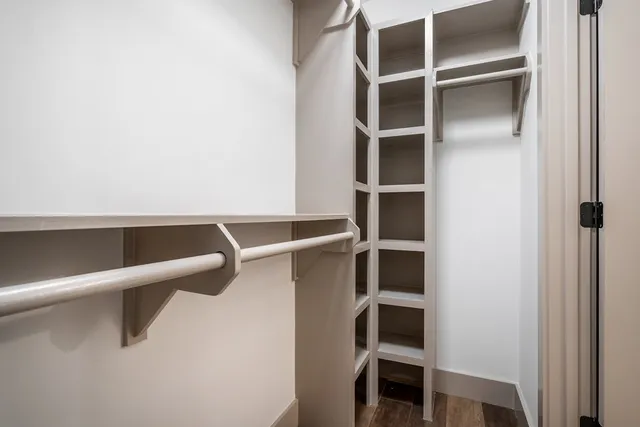 a bathroom with a double vanity sink mirror and shower