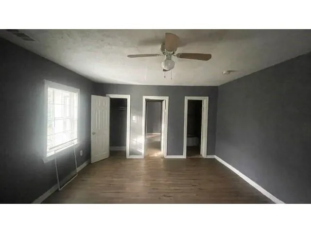 a room with lots of wooden furniture