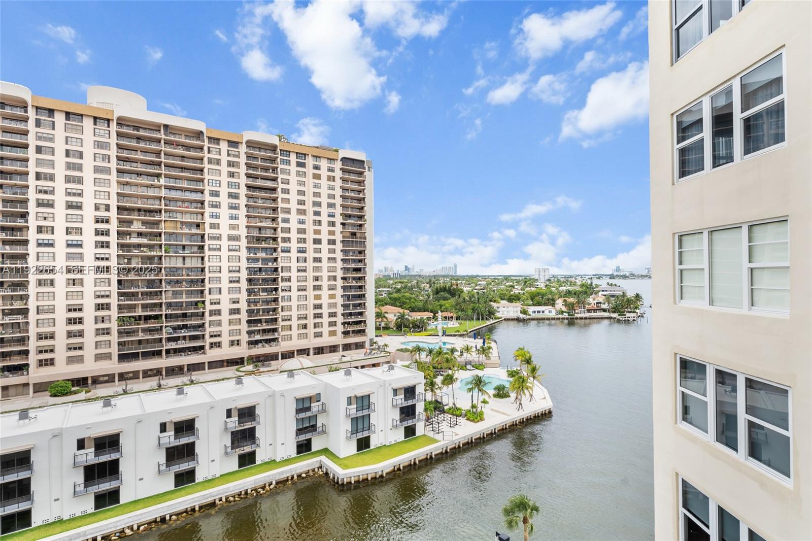 11111 Biscayne Boulevard, Unit 10H Miami, FL 33181 - Photo 15 of 22 a view of a large building with a lake view
