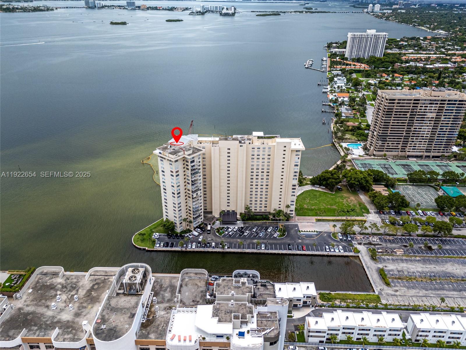 11111 Biscayne Boulevard, Unit 10H Miami, FL 33181 - Photo 17 of 22 a front view of a house with a yard