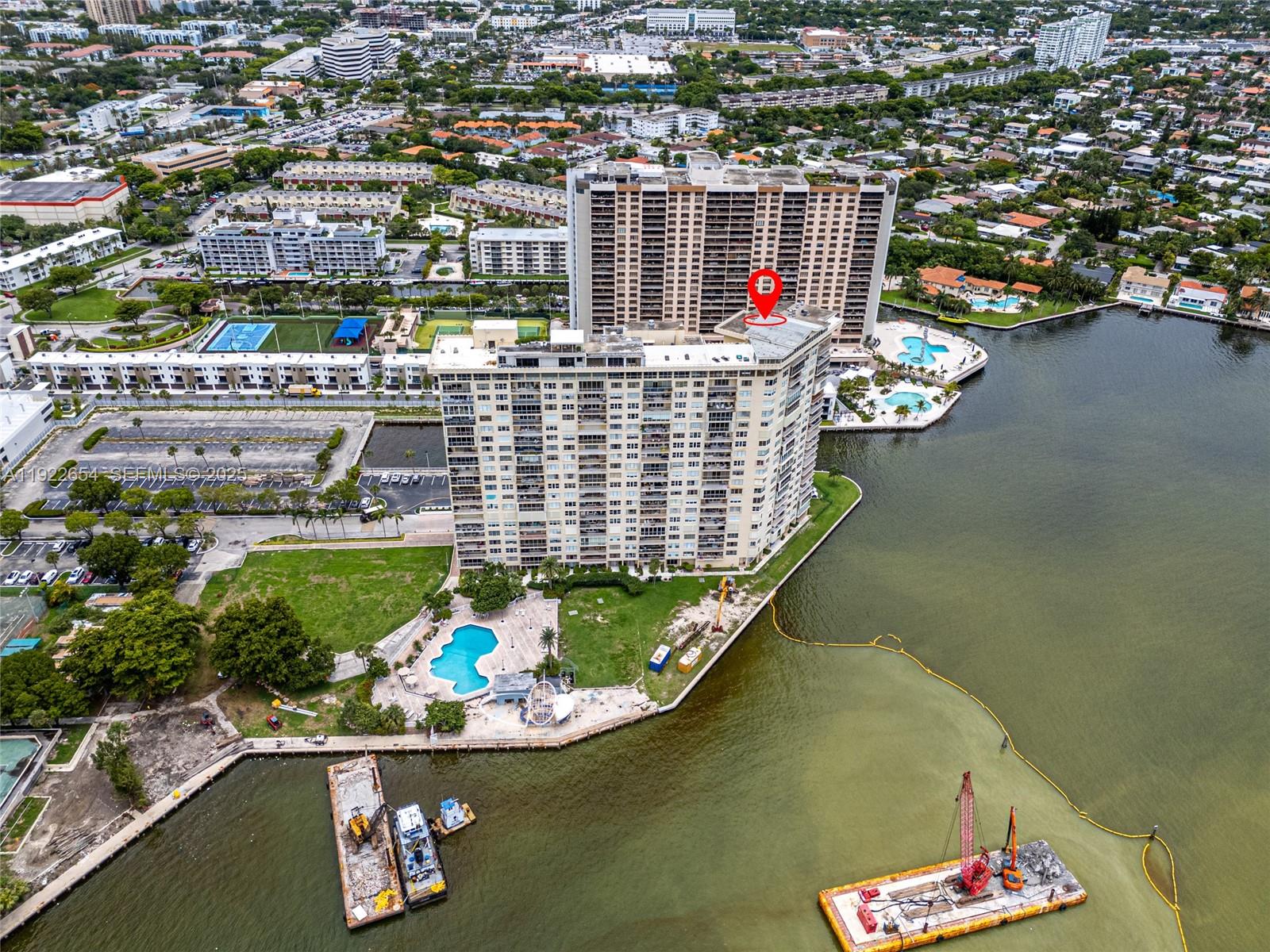 11111 Biscayne Boulevard, Unit 10H Miami, FL 33181 - Photo 19 of 22 view of a balcony with dining table and chairs