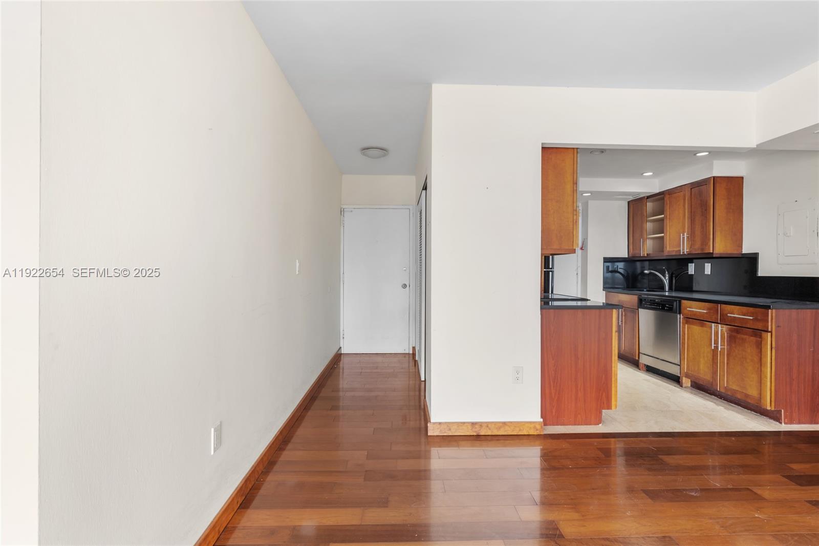 11111 Biscayne Boulevard, Unit 10H Miami, FL 33181 - Photo 6 of 22 a view of kitchen with wooden floor