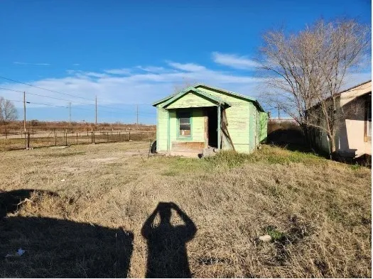 a view of a yard with a snow on the road