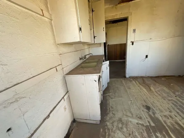 a view of a kitchen with storage and utility