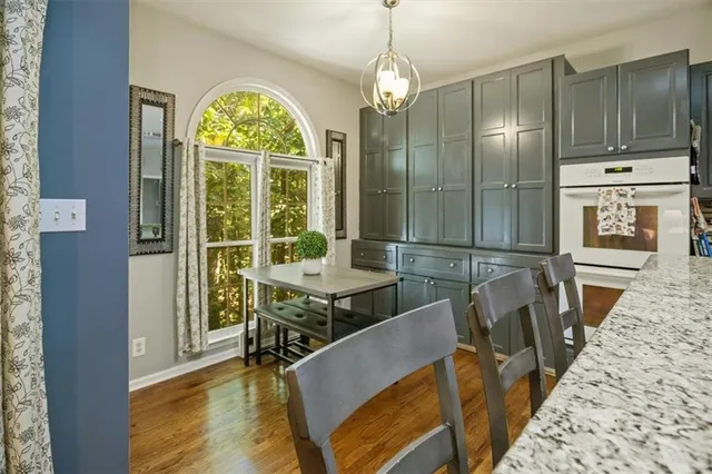a view of a dining room with furniture window and wooden floor