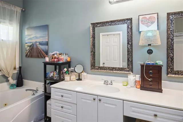 a bathroom with a sink and a mirror
