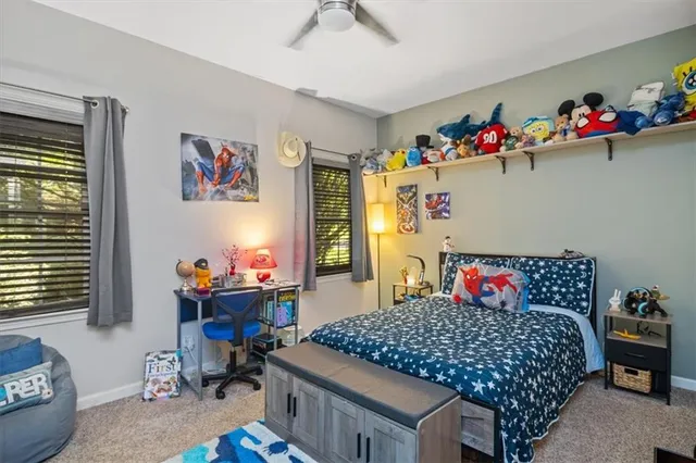 a bedroom with a bed and dresser