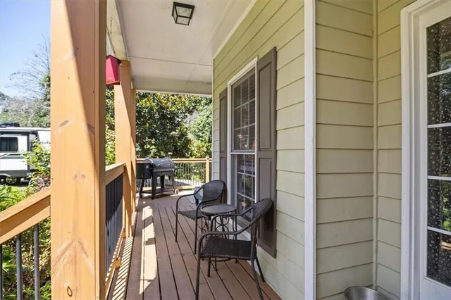 a view of balcony with two chairs and a table
