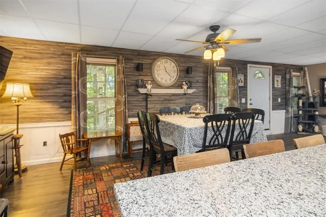 a view of a dining room with furniture window and wooden floor