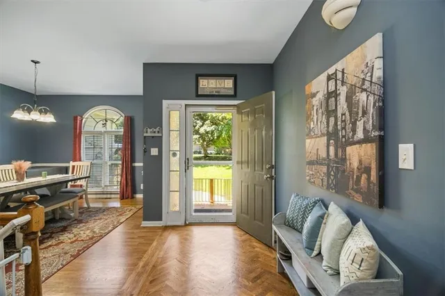 a view of a livingroom with furniture window and wooden floor