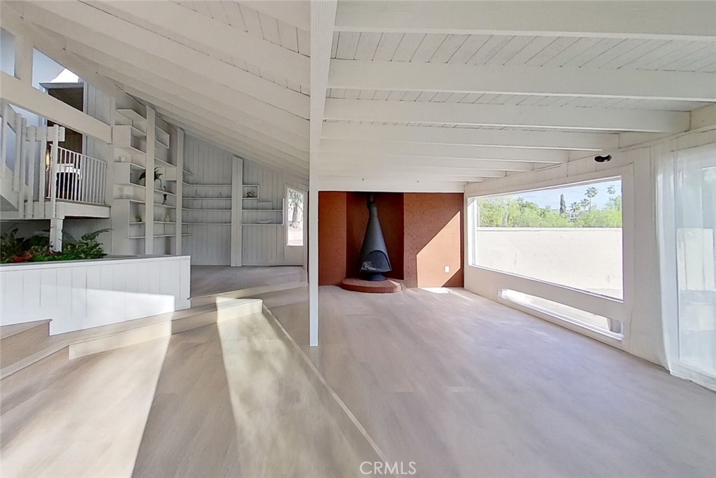 2390 Prenda Avenue Riverside, CA 92504 - Photo 12 of 21 a view of an empty room with wooden floor and a window
