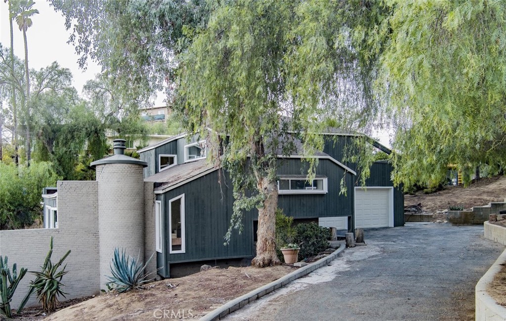 2390 Prenda Avenue Riverside, CA 92504 - Photo 4 of 21 a view of a house with a yard and large tree