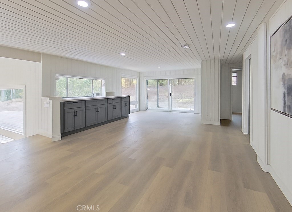 2390 Prenda Avenue Riverside, CA 92504 - Photo 6 of 21 wooden floor in an empty room with a kitchen