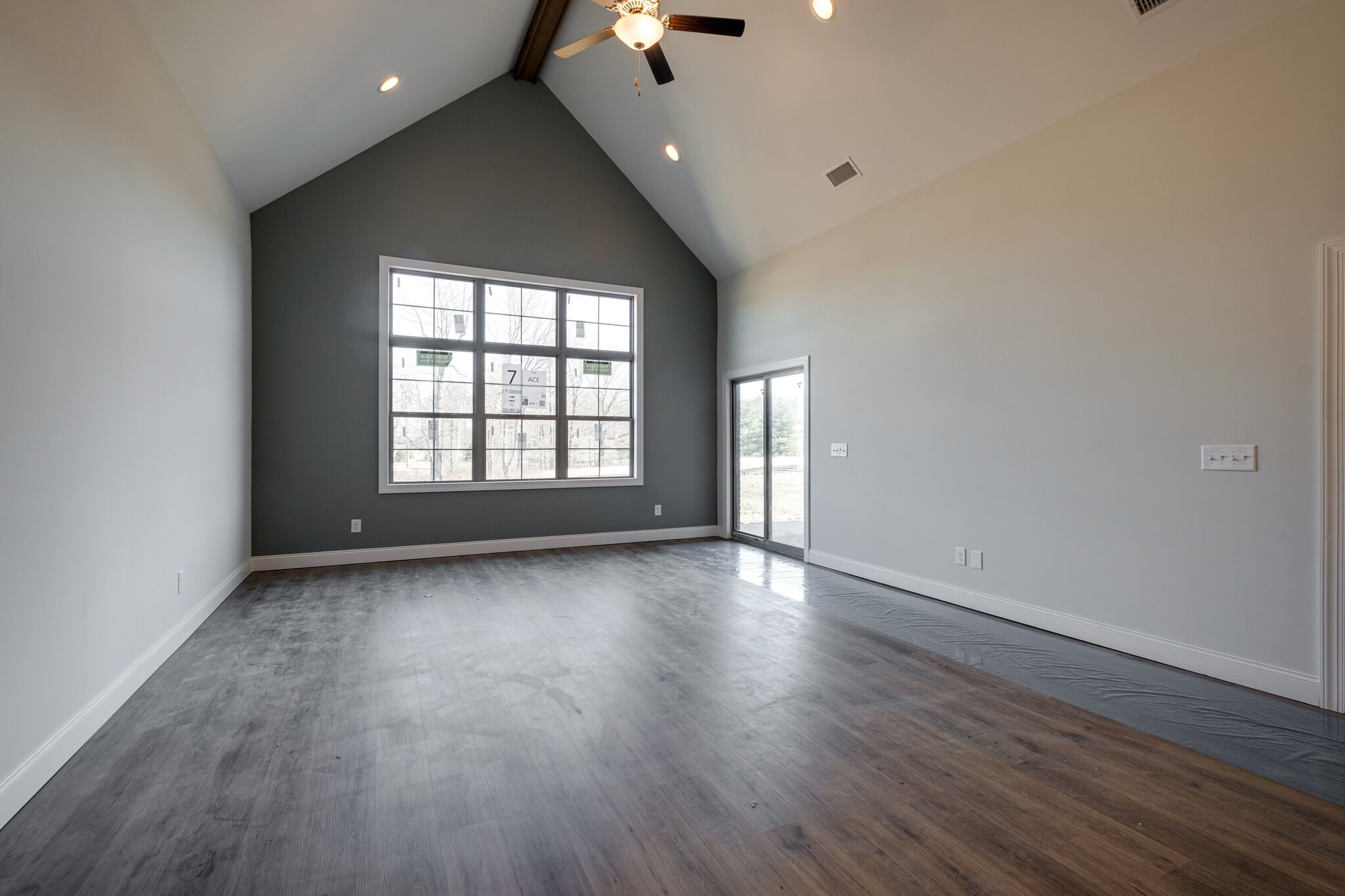7 The Greens Springfield, TN 37172 - Photo 11 of 29 a view of an empty room with wooden floor and a window