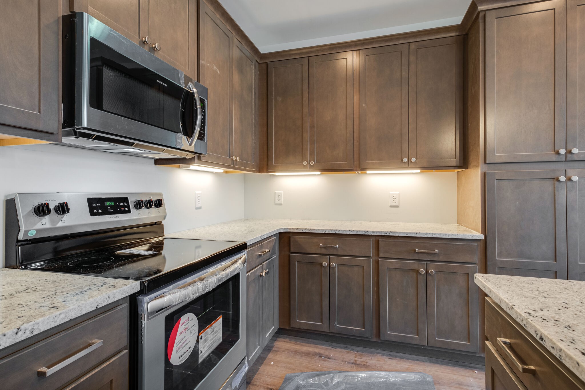 7 The Greens Springfield, TN 37172 - Photo 9 of 29 a kitchen with stainless steel appliances granite countertop a stove microwave and sink
