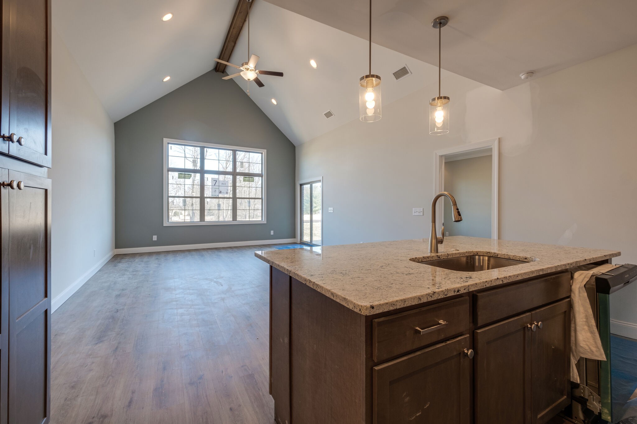 7 The Greens Springfield, TN 37172 - Photo 10 of 29 a kitchen with a sink chandelier and wooden floor