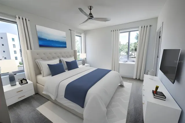 a bedroom with a bed and a flat screen tv