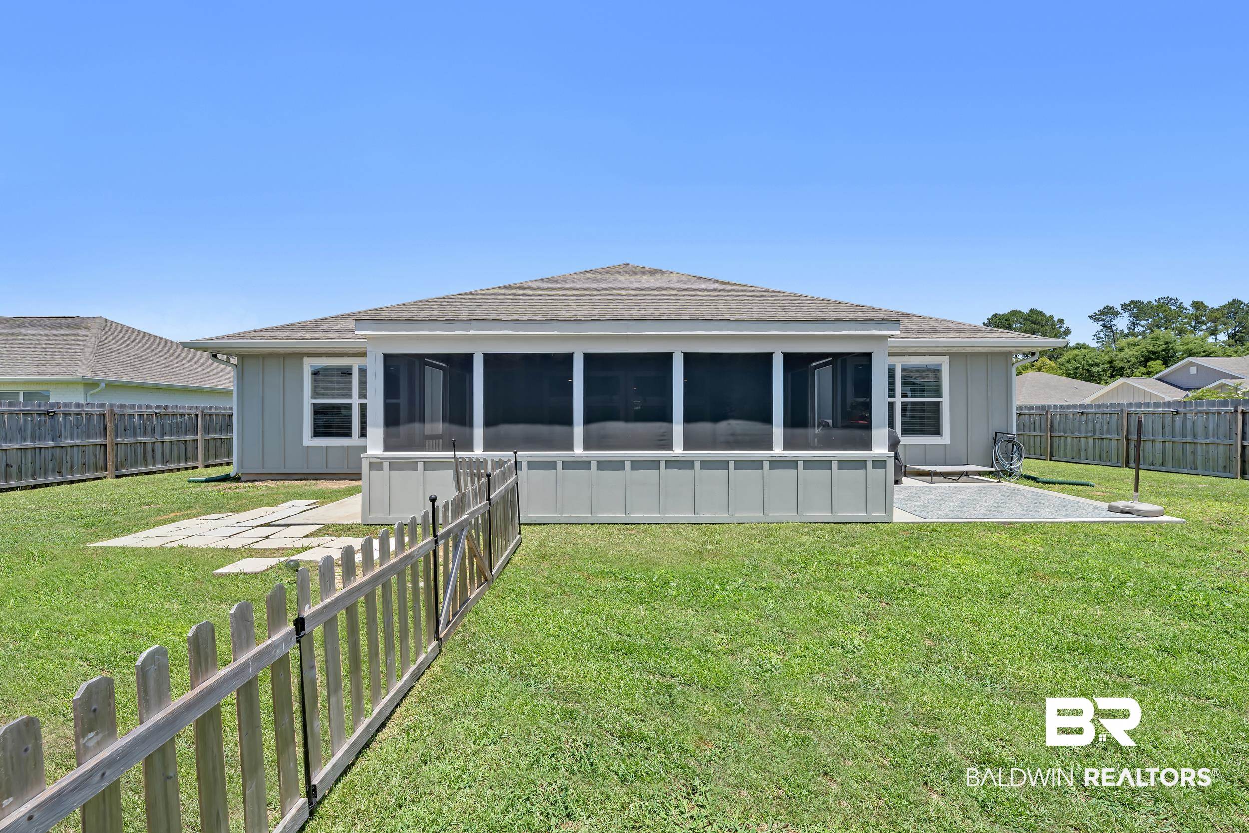 24271 Ringneck Loop Elberta, AL 36530 - Photo 39 of 44 Rear exterior featuring a screened porch, a pitched roofline, and light gray siding
