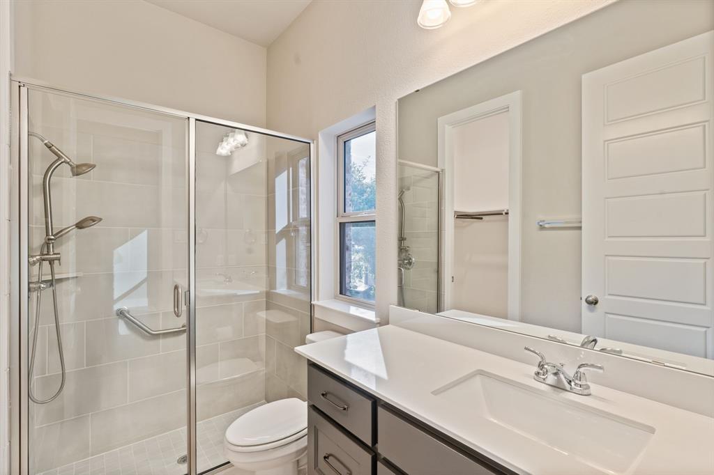 1314 Buttermere Street Forney, TX 75126 - Photo 20 of 32 a bathroom with a sink toilet and shower