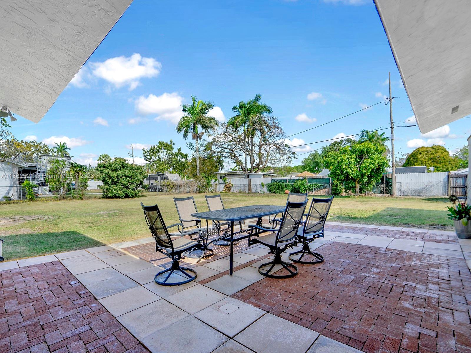 131 Northeast 17th Street Homestead, FL 33030 - Photo 19 of 24 a view of a backyard with sitting area