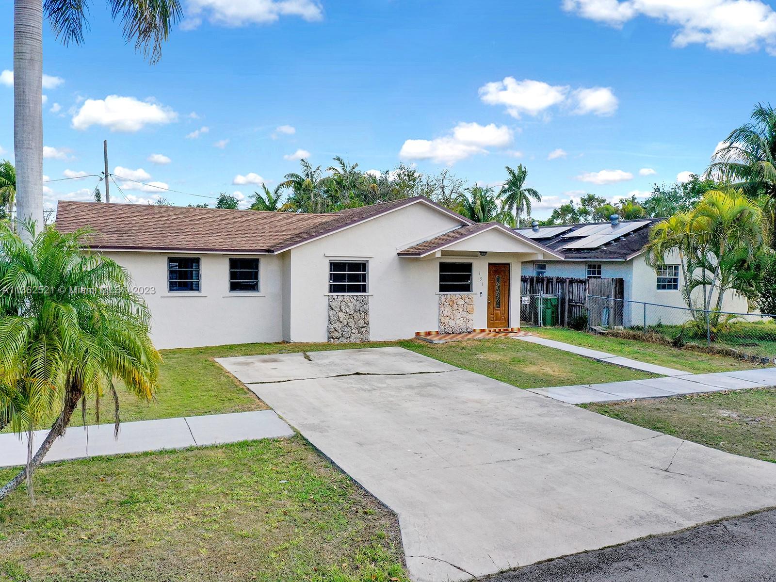 131 Northeast 17th Street Homestead, FL 33030 - Photo 20 of 24 a view of a yard in front of house