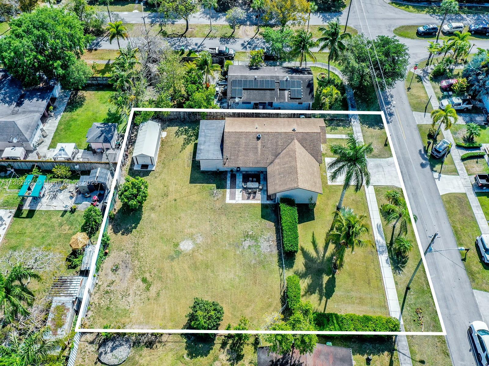 131 Northeast 17th Street Homestead, FL 33030 - Photo 2 of 24 an aerial view of a house with swimming pool