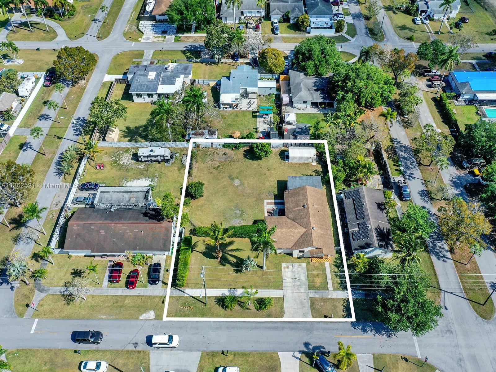 131 Northeast 17th Street Homestead, FL 33030 - Photo 24 of 24 an aerial view of multiple houses with yard