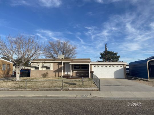 408 North Florence Street Ridgecrest, CA 93555 - Photo 1 of 1 front view of house with a yard