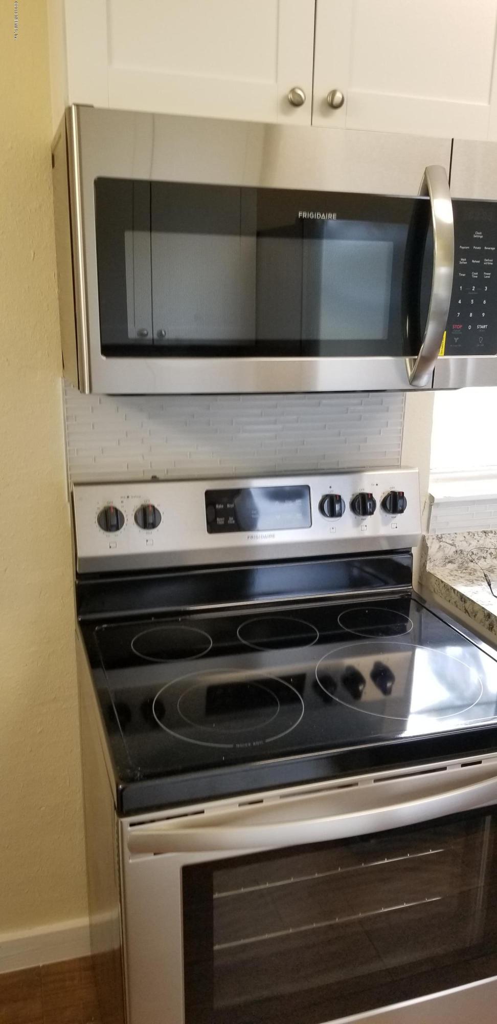 1847 Griflet Road Jacksonville, FL 32211 - Photo 14 of 32 a view of a stove top oven