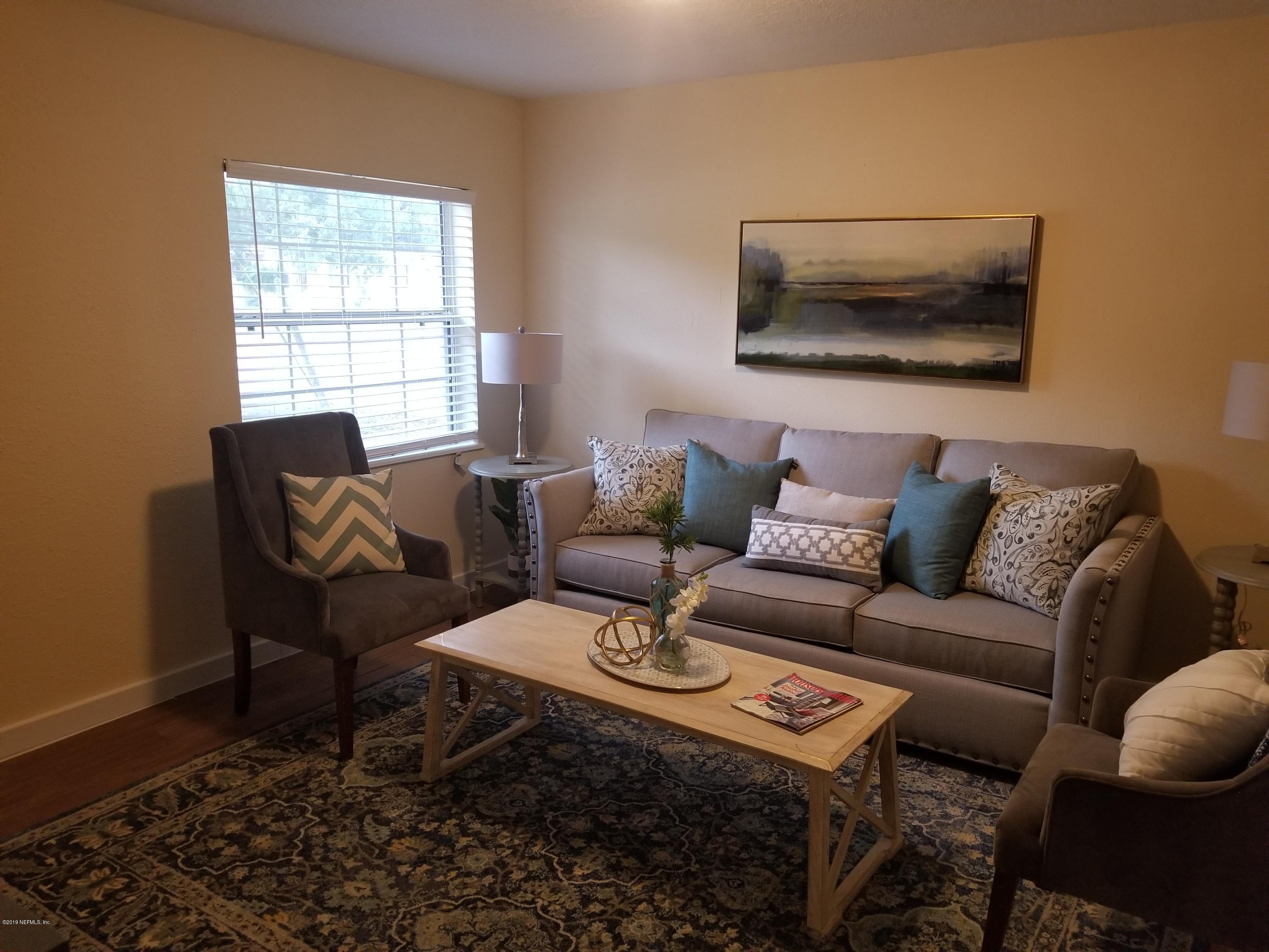 1847 Griflet Road Jacksonville, FL 32211 - Photo 20 of 32 a living room with furniture and a window