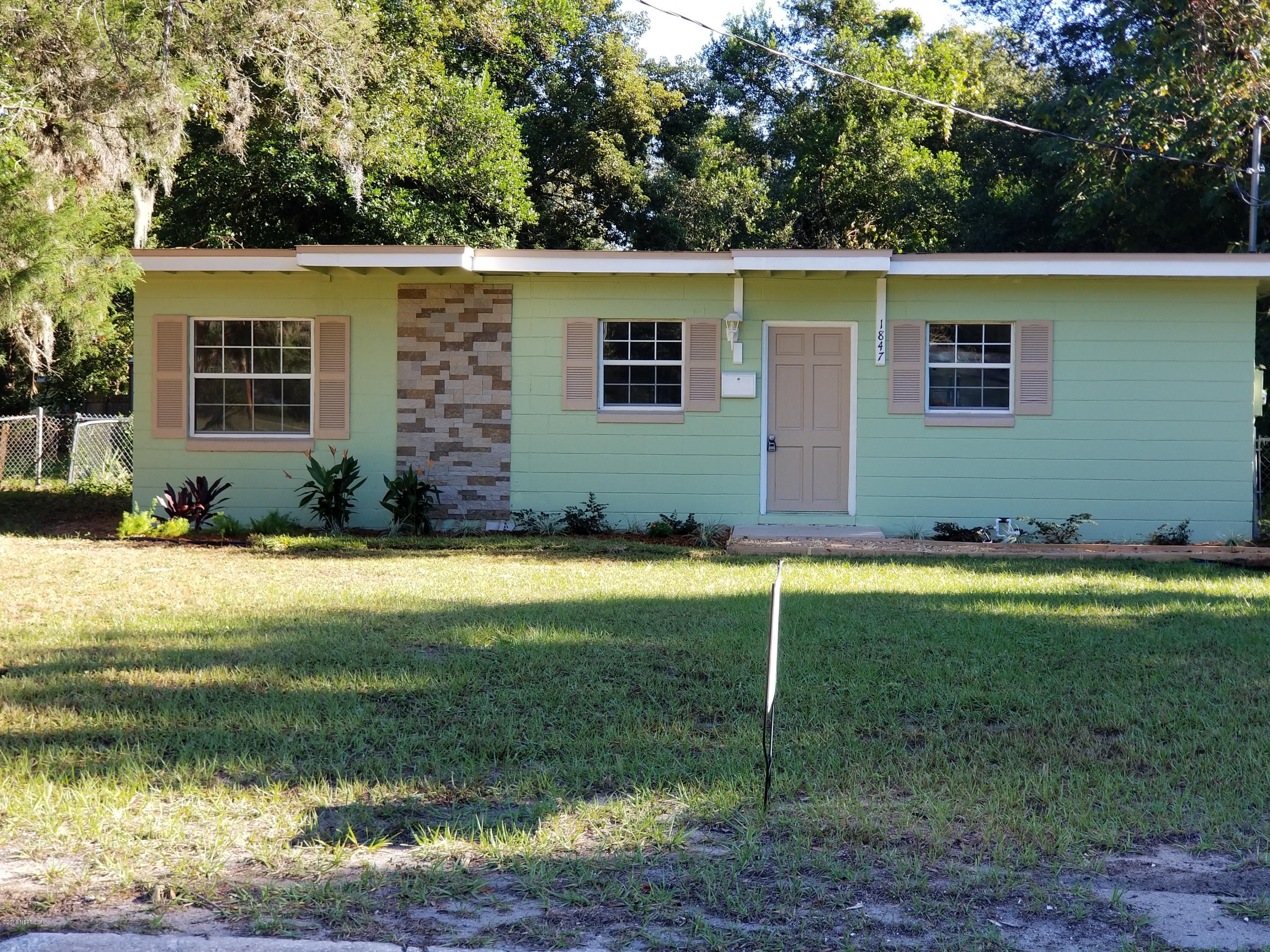 1847 Griflet Road Jacksonville, FL 32211 - Photo 2 of 32 a view of a house with a backyard
