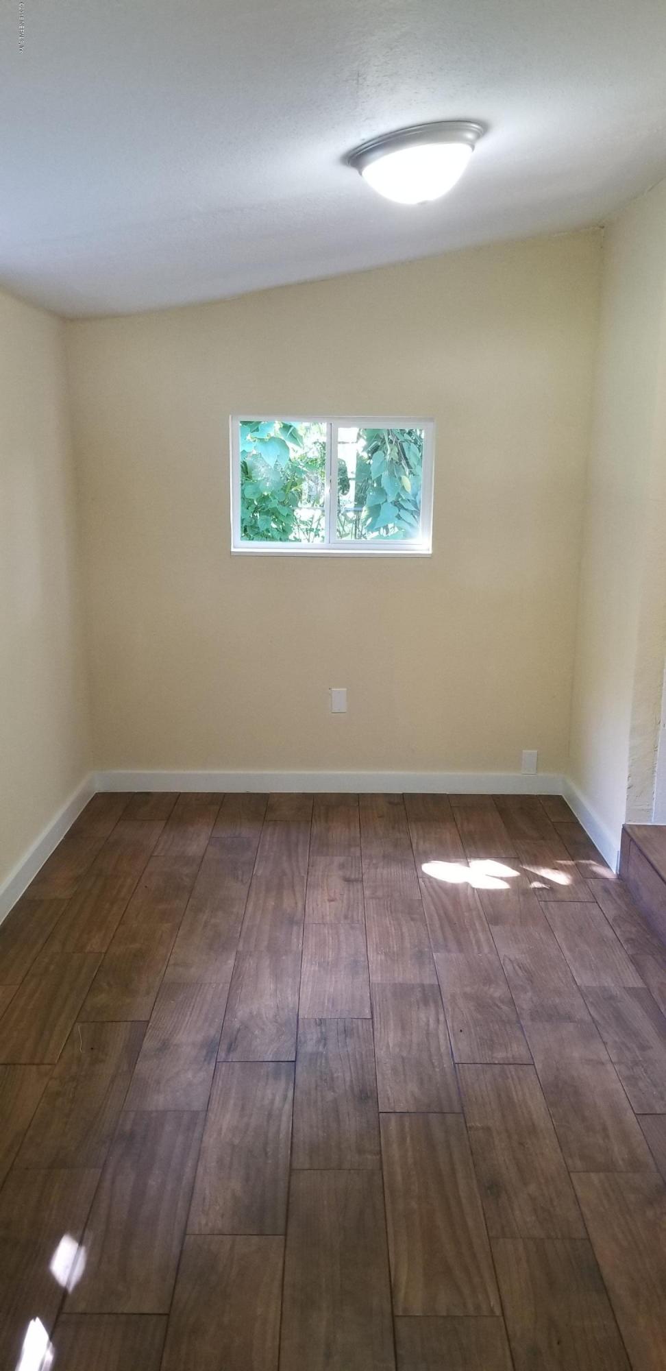 1847 Griflet Road Jacksonville, FL 32211 - Photo 25 of 32 an empty room with a empty space and window