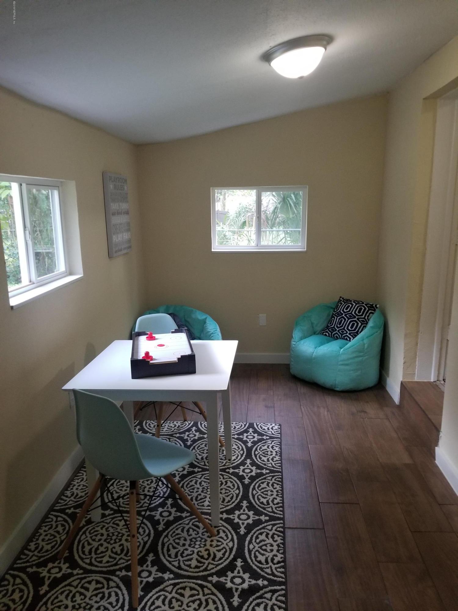 1847 Griflet Road Jacksonville, FL 32211 - Photo 26 of 32 a living room with furniture and a window