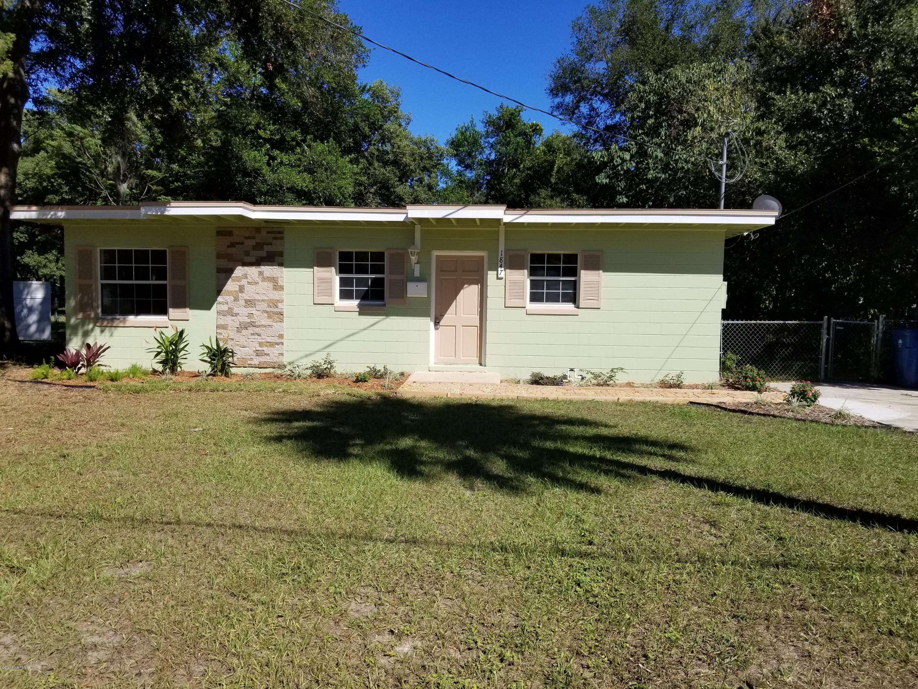 1847 Griflet Road Jacksonville, FL 32211 - Photo 3 of 32 a bathroom with a sink and a yard
