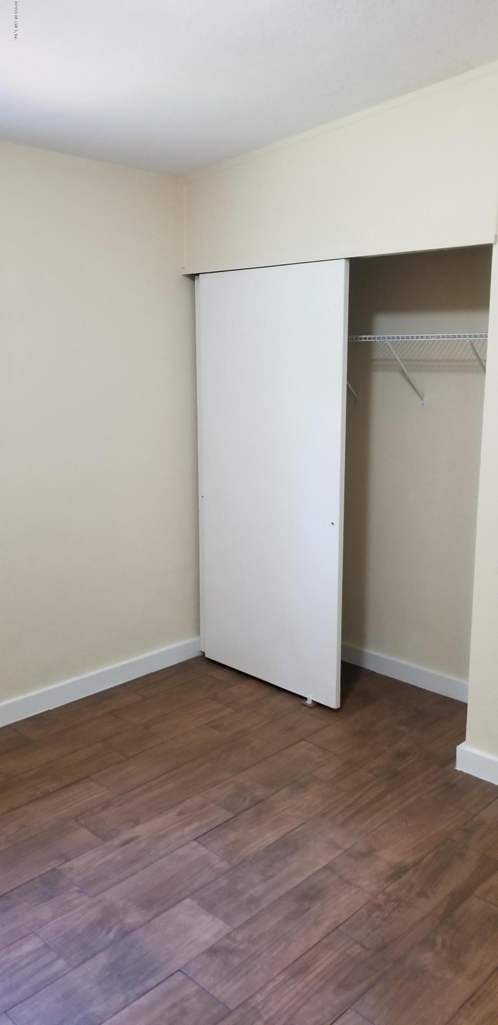 1847 Griflet Road Jacksonville, FL 32211 - Photo 31 of 32 a view of an empty room with wooden floor
