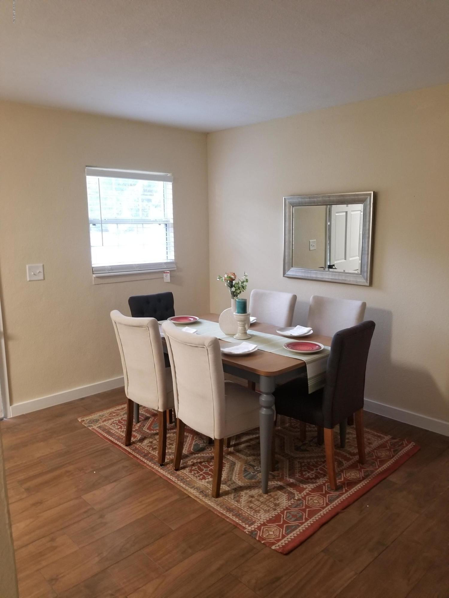 1847 Griflet Road Jacksonville, FL 32211 - Photo 9 of 32 a view of a dining room with a table and chairs