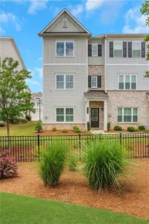 a front view of a house with a yard table and chairs