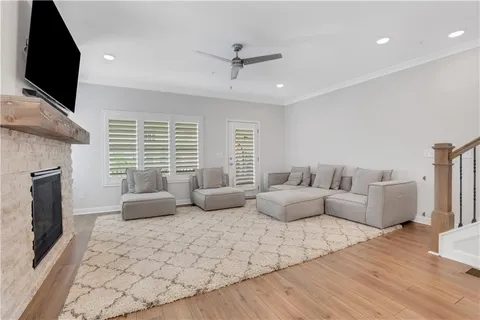 a living room with furniture fireplace and flat screen tv
