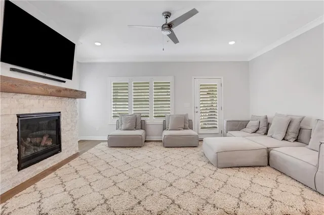 a living room with furniture and a fireplace