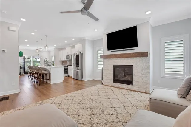 a living room with fireplace furniture and a flat screen tv