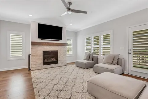 a living room with furniture fireplace and flat screen tv