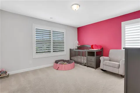 a bedroom with furniture and windows