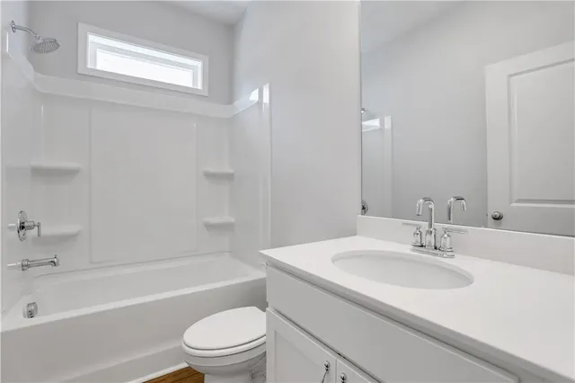 a bathroom with a sink a toilet and a bathtub