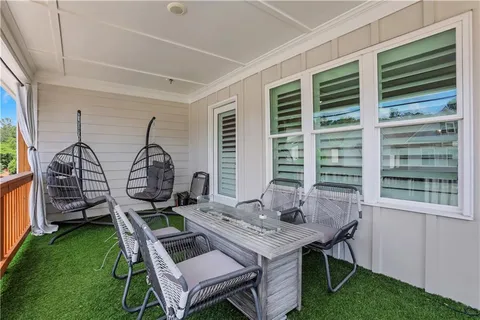 a view of a room that has a table and chairs